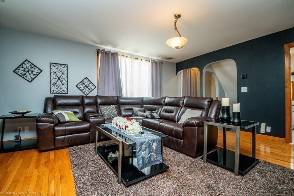 478 Third Street Fall River, MA 02721 - Photo 21 of 35 a living room with furniture and a chandelier