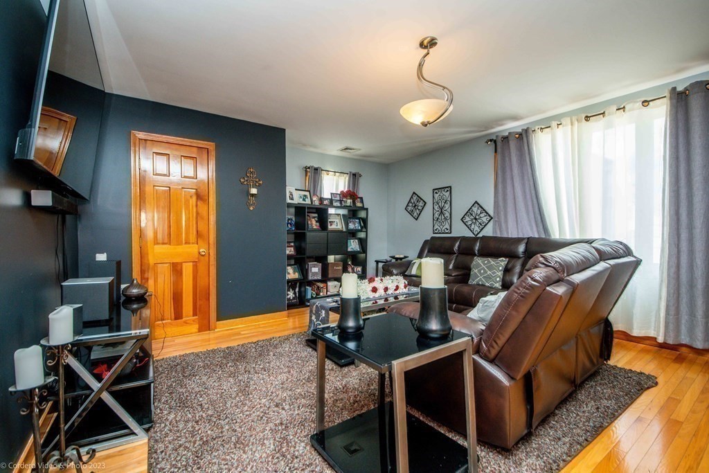 478 Third Street Fall River, MA 02721 - Photo 23 of 35 a living room with furniture a window and gym equipment