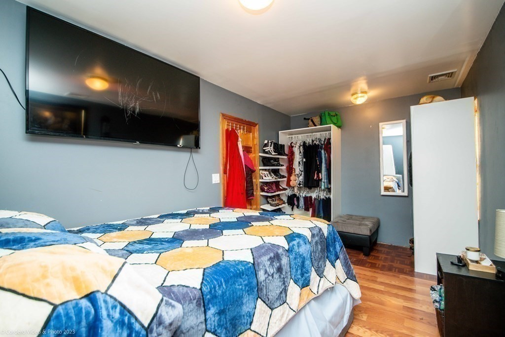 478 Third Street Fall River, MA 02721 - Photo 26 of 35 a bedroom with bed and a flat screen tv