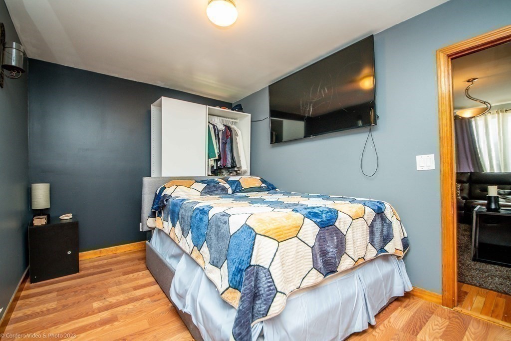 478 Third Street Fall River, MA 02721 - Photo 27 of 35 a bedroom with a bed and a flat screen tv