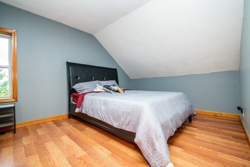 478 Third Street Fall River, MA 02721 - Photo 30 of 35 a bedroom with a bed and window