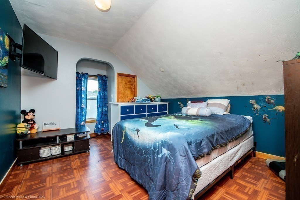 478 Third Street Fall River, MA 02721 - Photo 32 of 35 a bedroom with a bed and flat screen tv