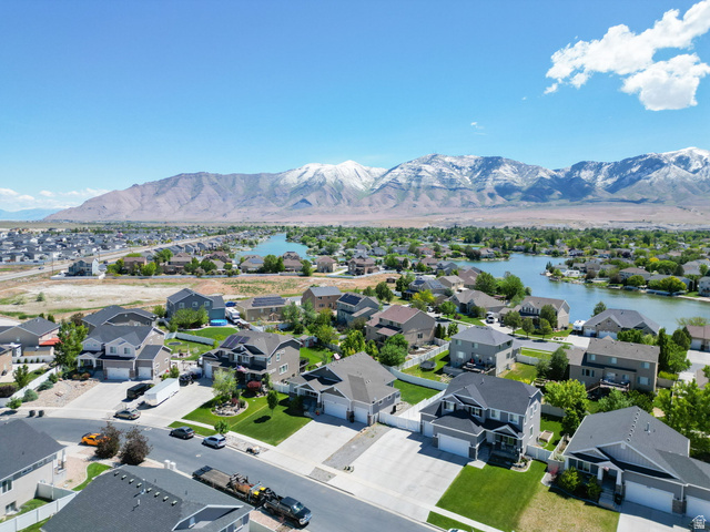 6062 Spring Street Stansbury Park, UT 84074 - Photo 33 of 36 Community featuring a lake and mountain backdrop with established residential properties