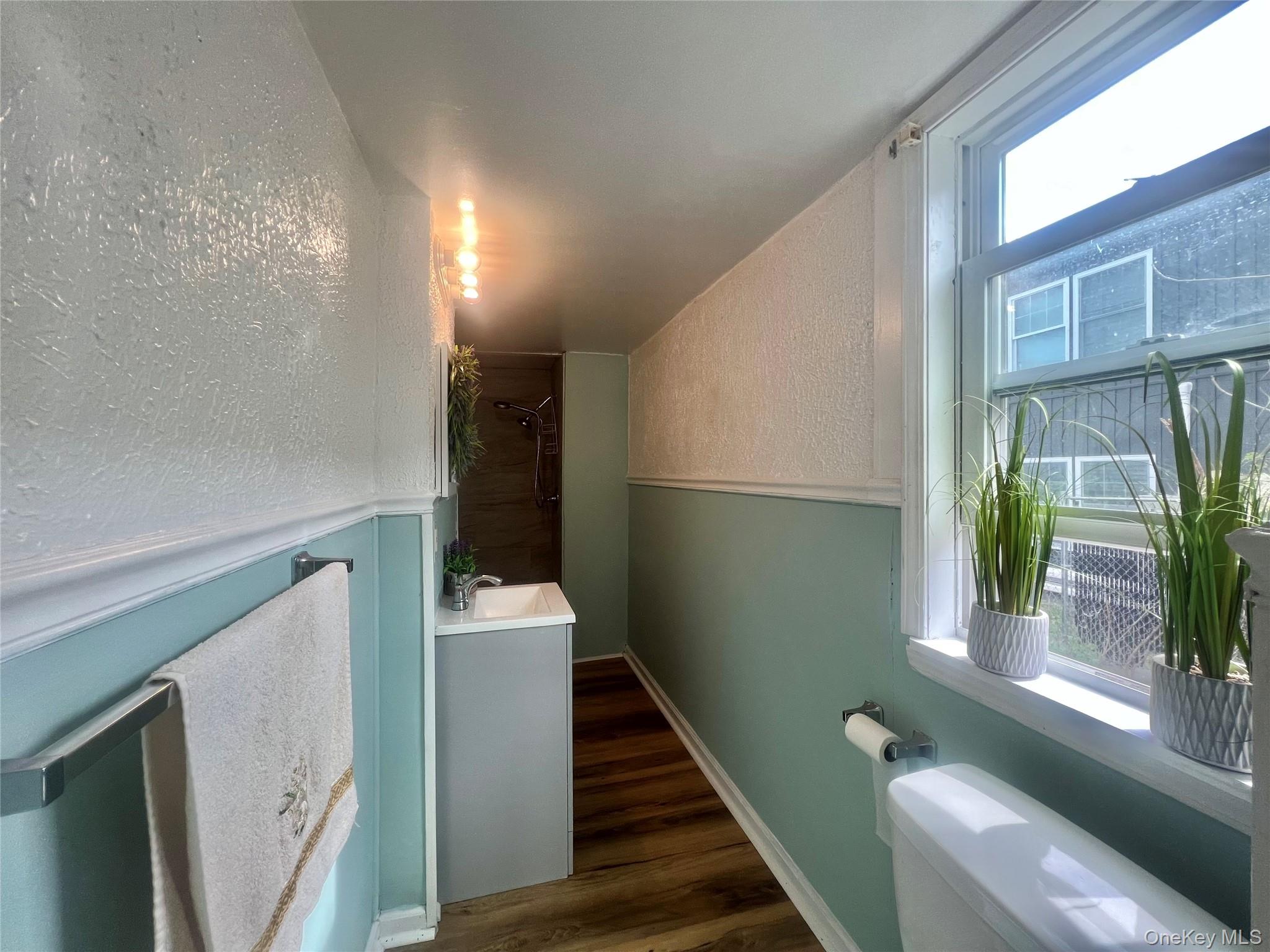 34 Smith Street Poughkeepsie, NY 12601 - Photo 11 of 46 a view of entryway and hall with wooden floor