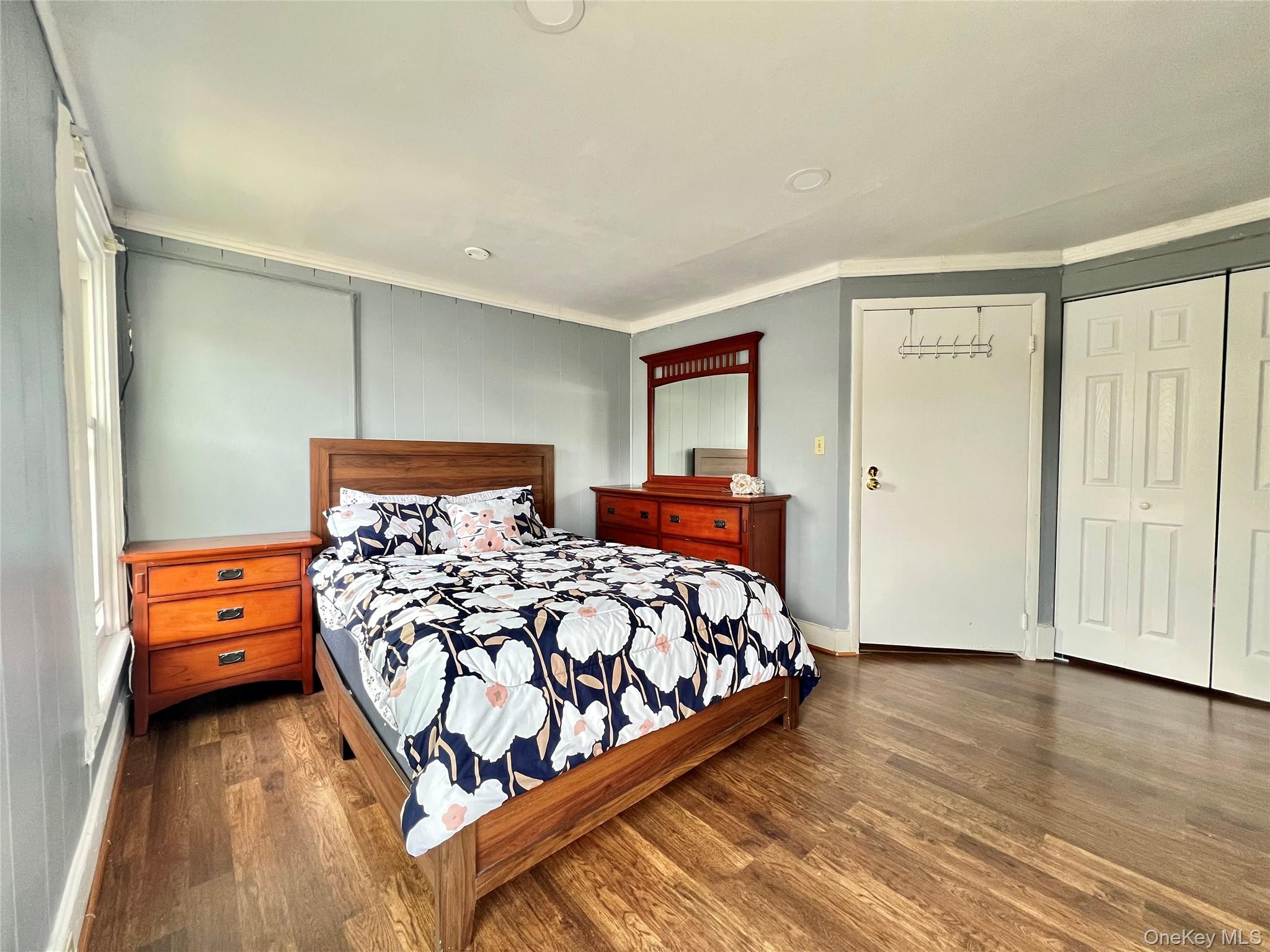 34 Smith Street Poughkeepsie, NY 12601 - Photo 21 of 46 a bedroom with a bed and wooden floor