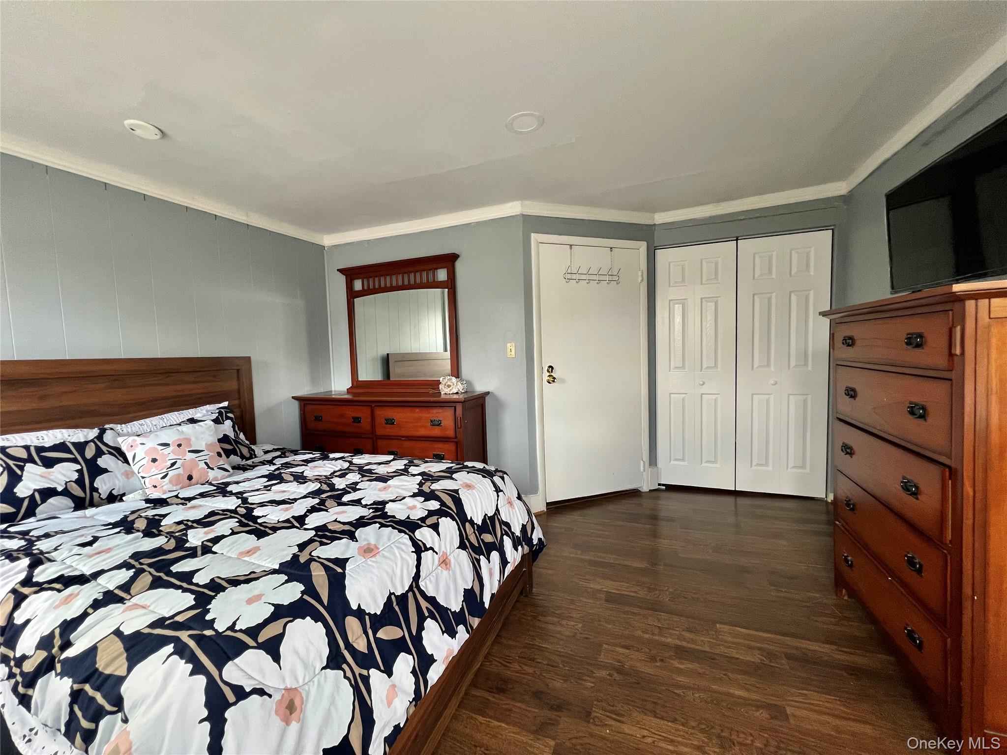 34 Smith Street Poughkeepsie, NY 12601 - Photo 22 of 46 a bedroom with a bed and a flat screen tv