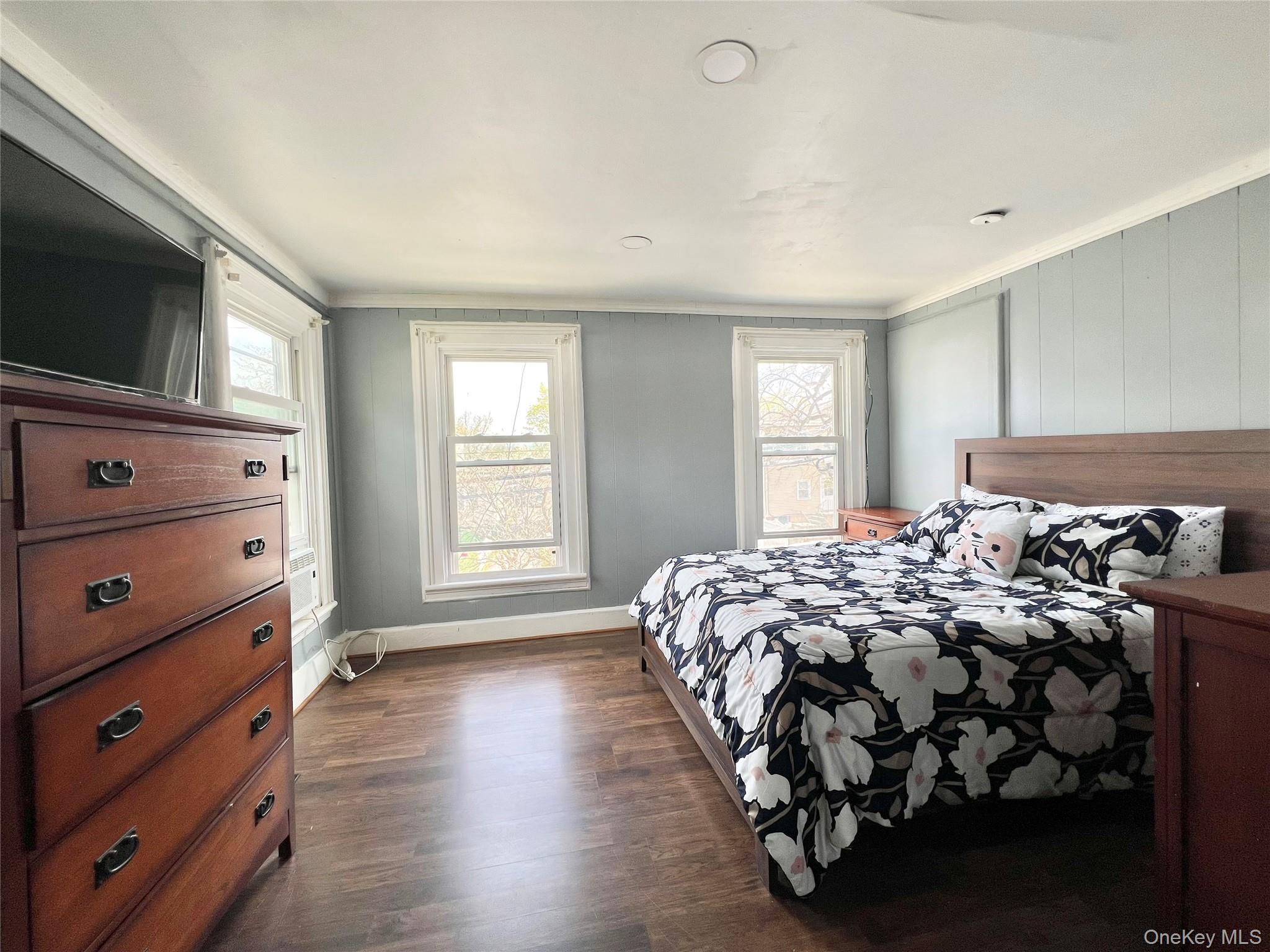 34 Smith Street Poughkeepsie, NY 12601 - Photo 25 of 46 a bedroom with a bed and a flat screen tv