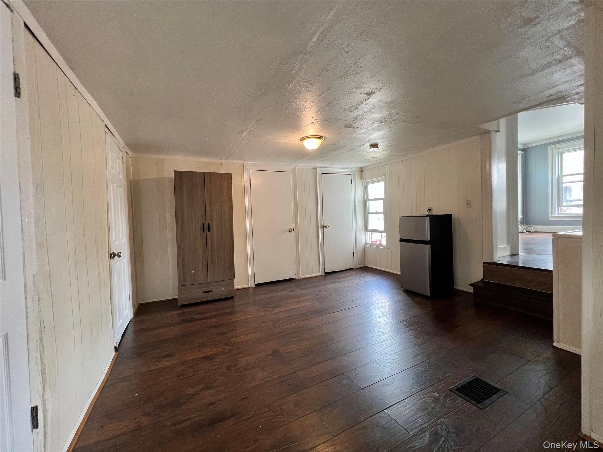 34 Smith Street Poughkeepsie, NY 12601 - Photo 28 of 46 a view of an empty room with wooden floor and a window