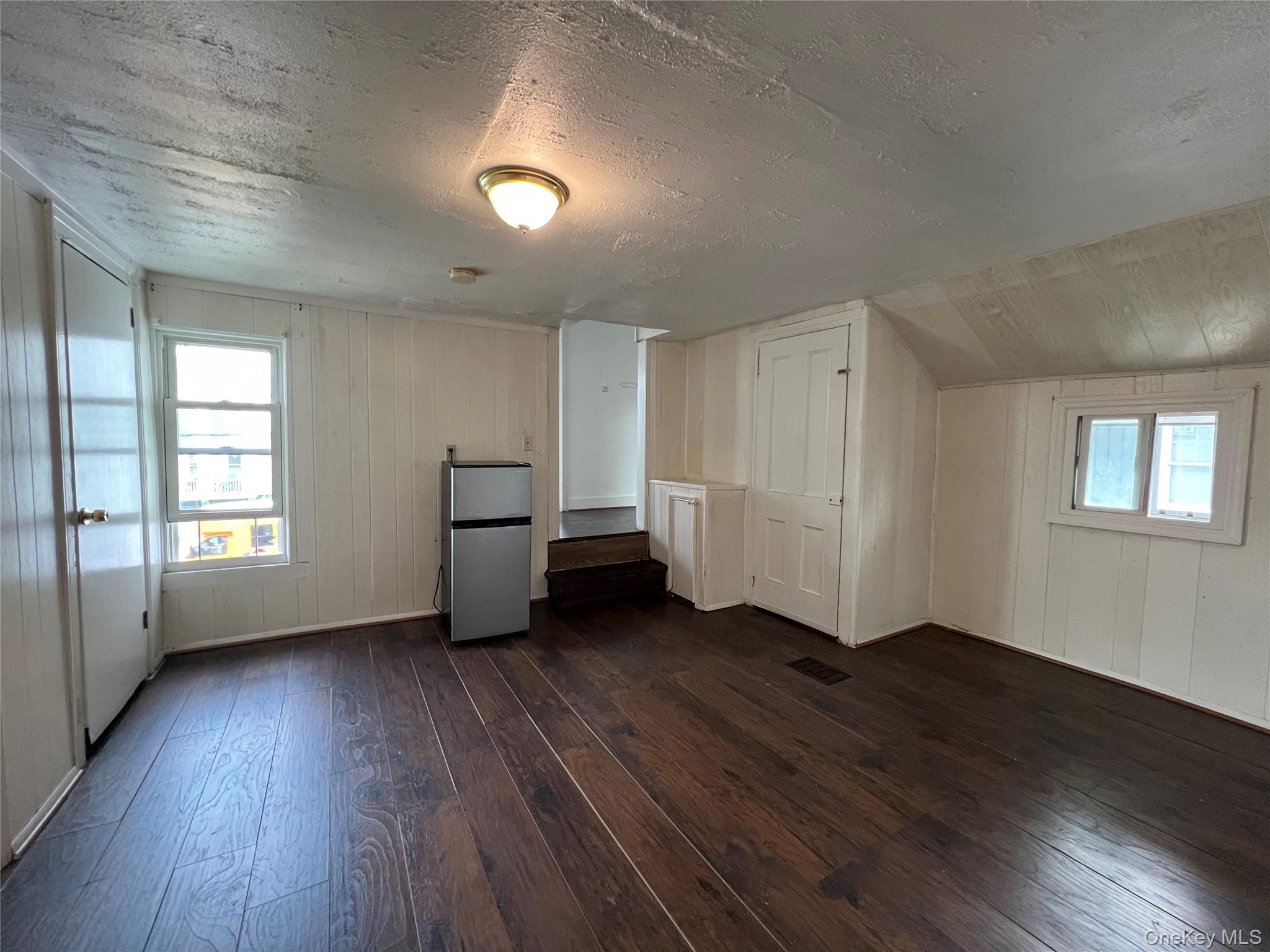 34 Smith Street Poughkeepsie, NY 12601 - Photo 29 of 46 an empty room with wooden floor and windows