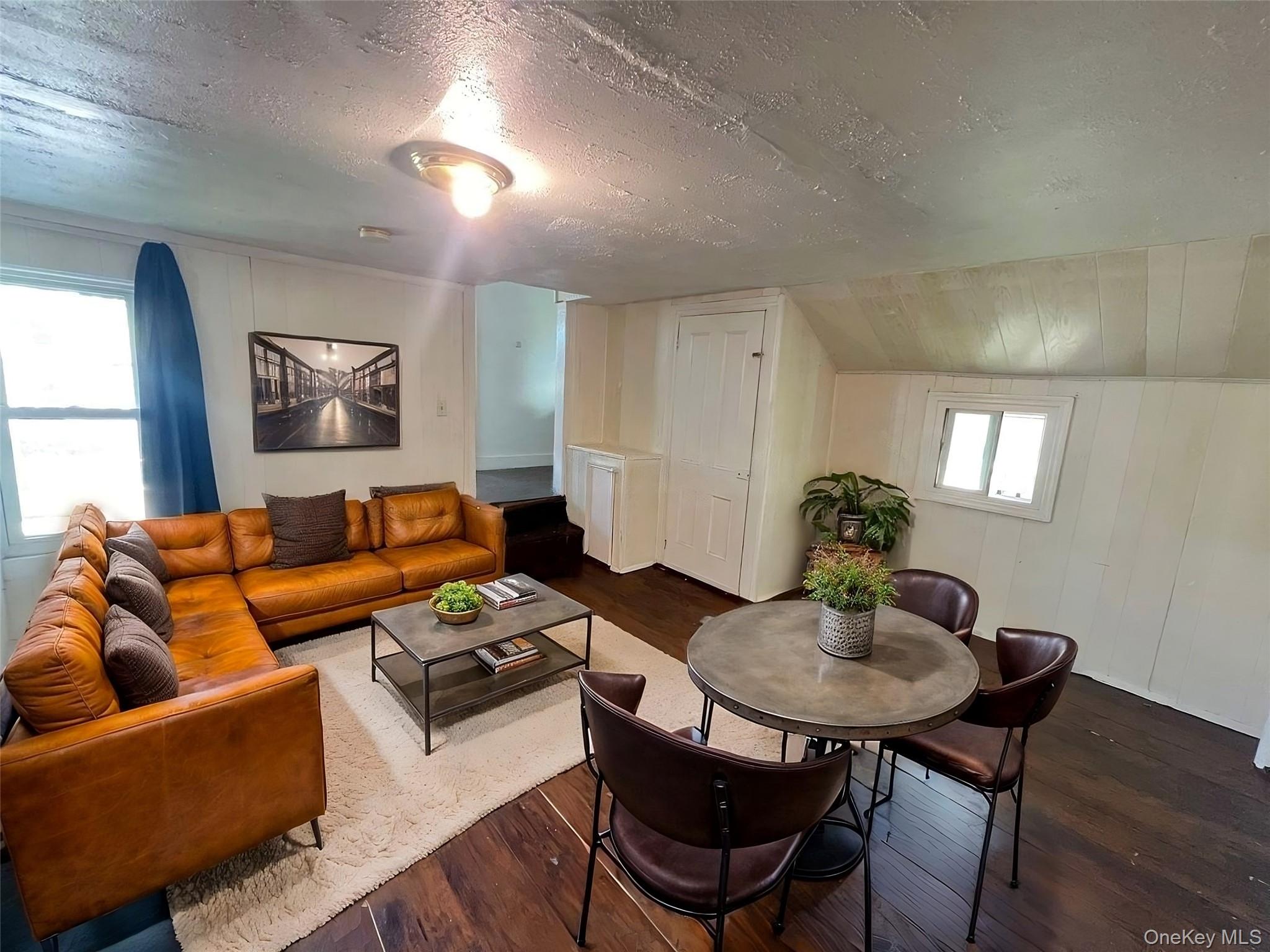 34 Smith Street Poughkeepsie, NY 12601 - Photo 30 of 46 a living room with furniture and a wooden floor