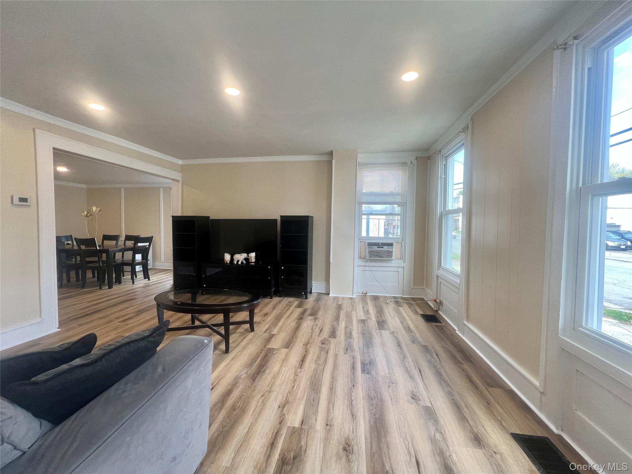 34 Smith Street Poughkeepsie, NY 12601 - Photo 3 of 46 a living room with furniture and a flat screen tv