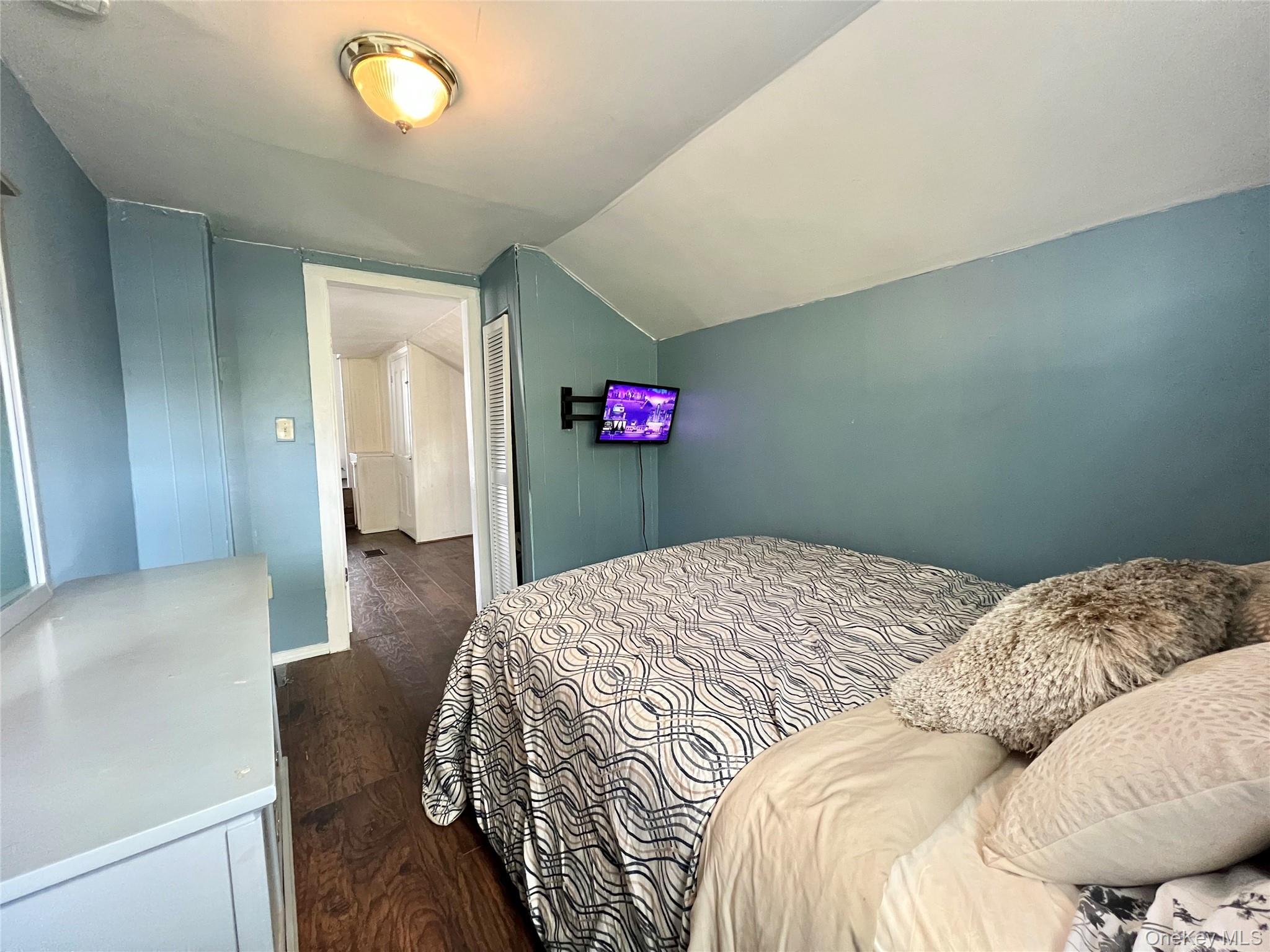 34 Smith Street Poughkeepsie, NY 12601 - Photo 32 of 46 a bedroom with a bed and a chandelier