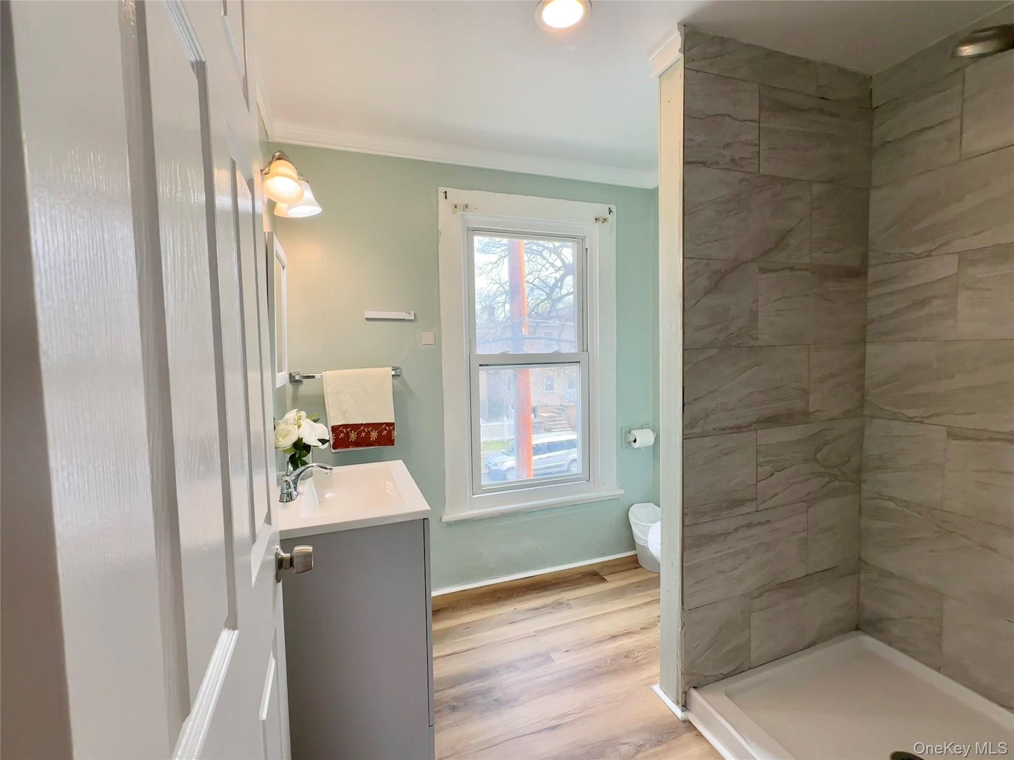 34 Smith Street Poughkeepsie, NY 12601 - Photo 33 of 46 a bathroom with a sink and a mirror