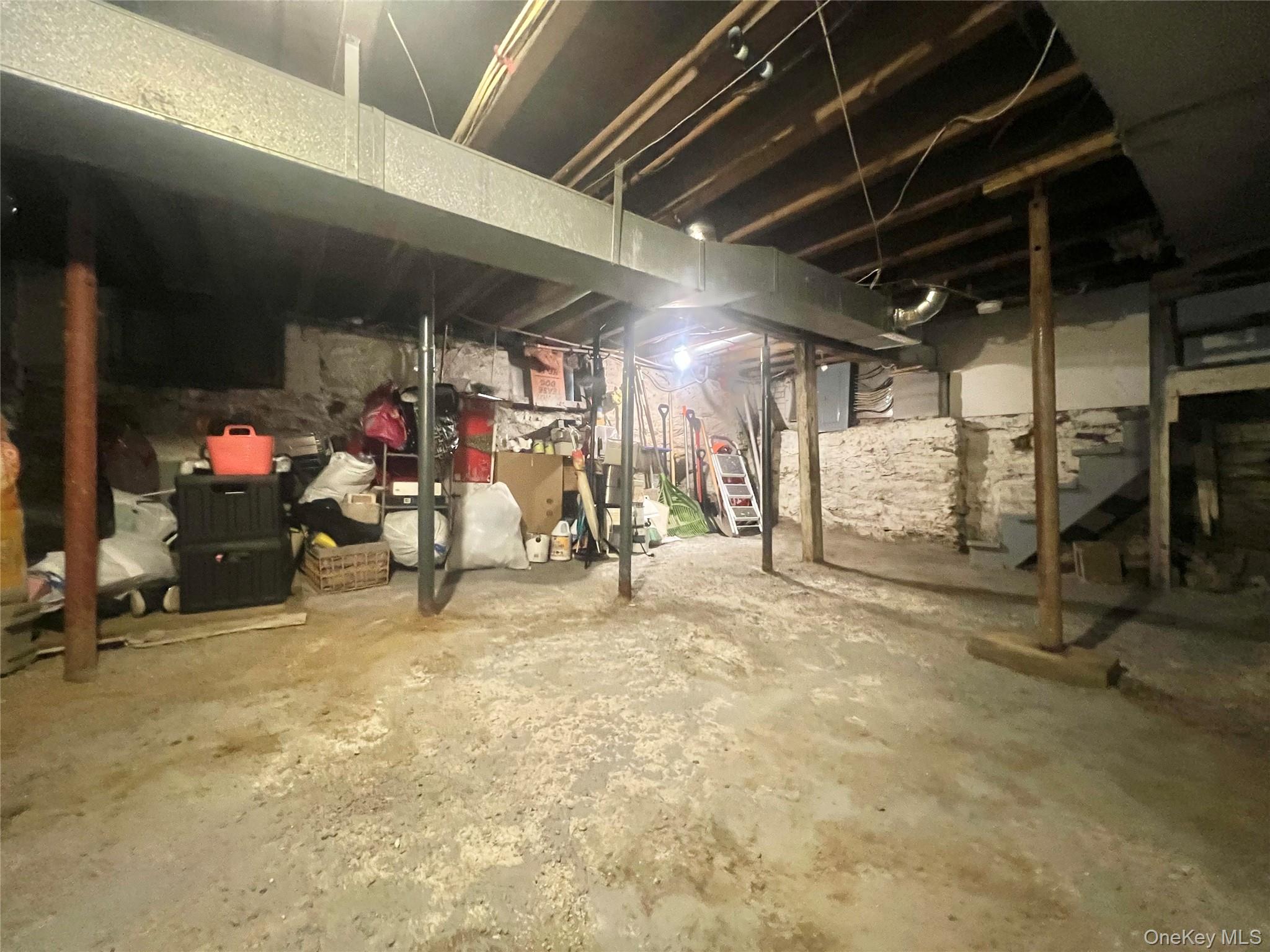 34 Smith Street Poughkeepsie, NY 12601 - Photo 39 of 46 a view of a garage with a bike and car
