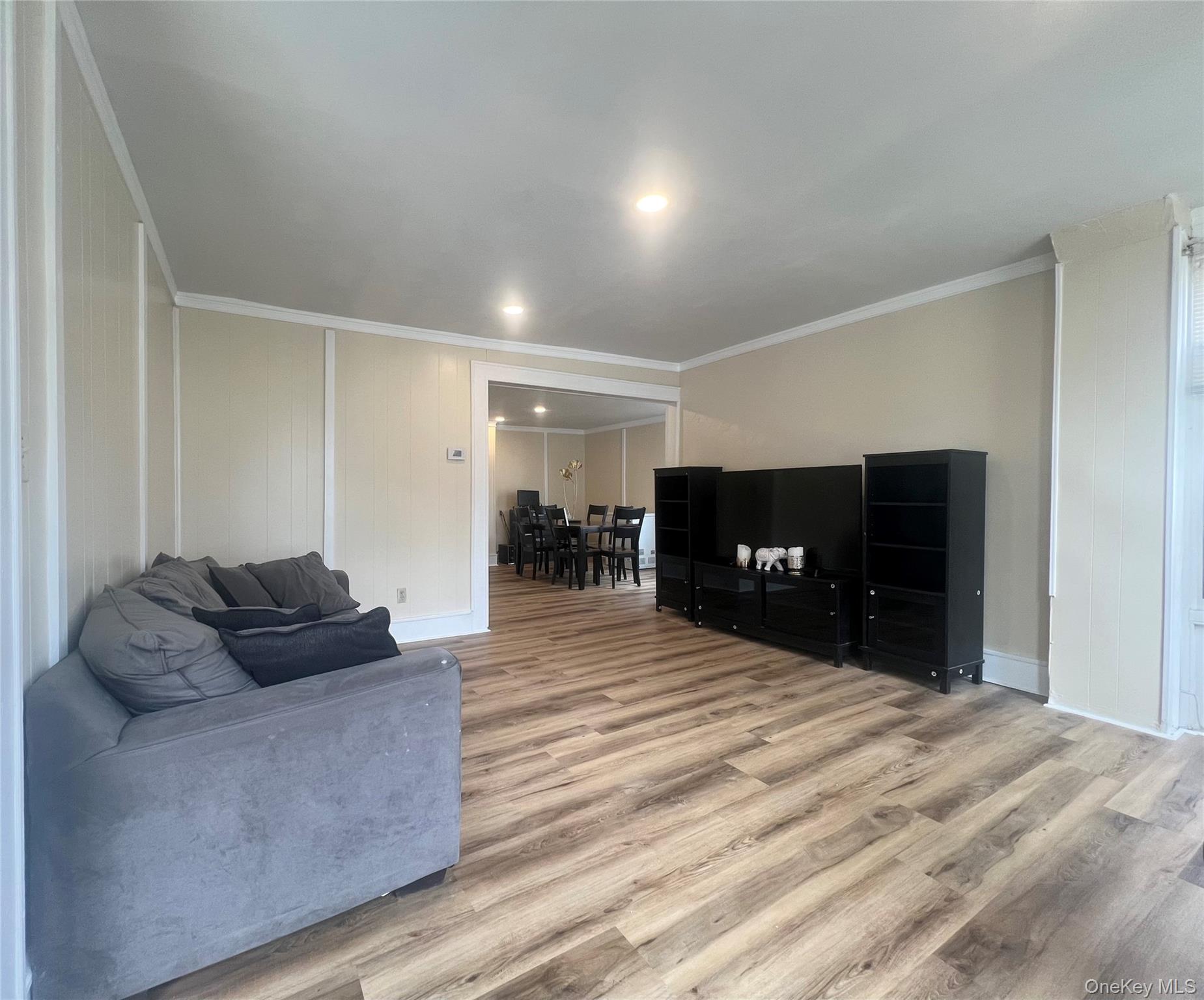 34 Smith Street Poughkeepsie, NY 12601 - Photo 4 of 46 a living room with furniture and a bed