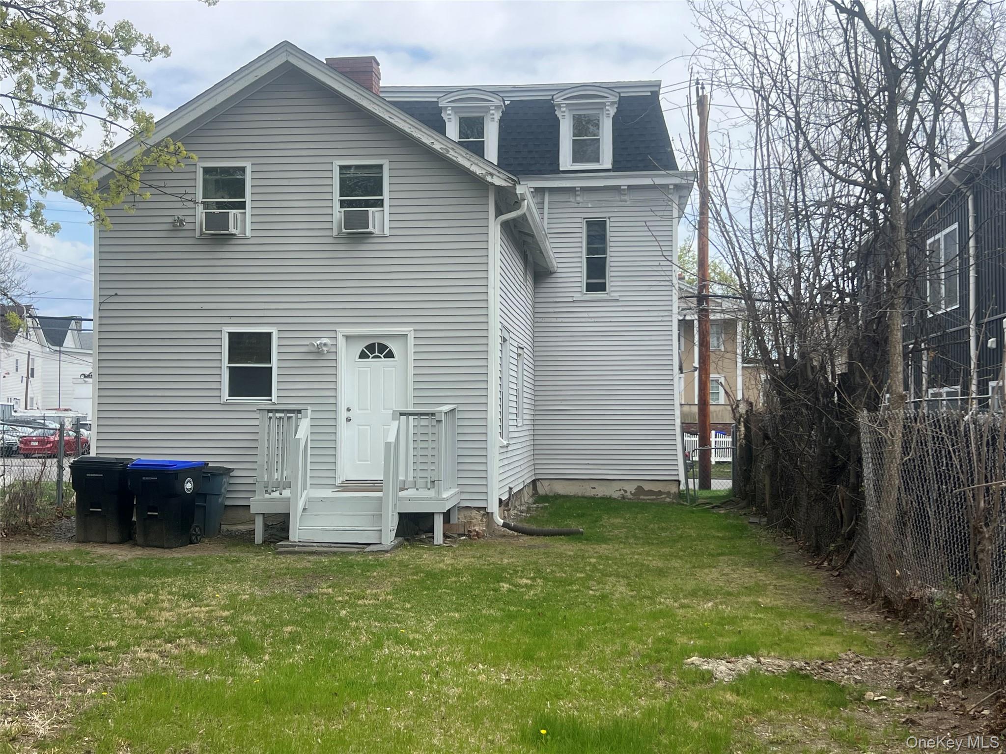 34 Smith Street Poughkeepsie, NY 12601 - Photo 43 of 46 front view of a house with a yard