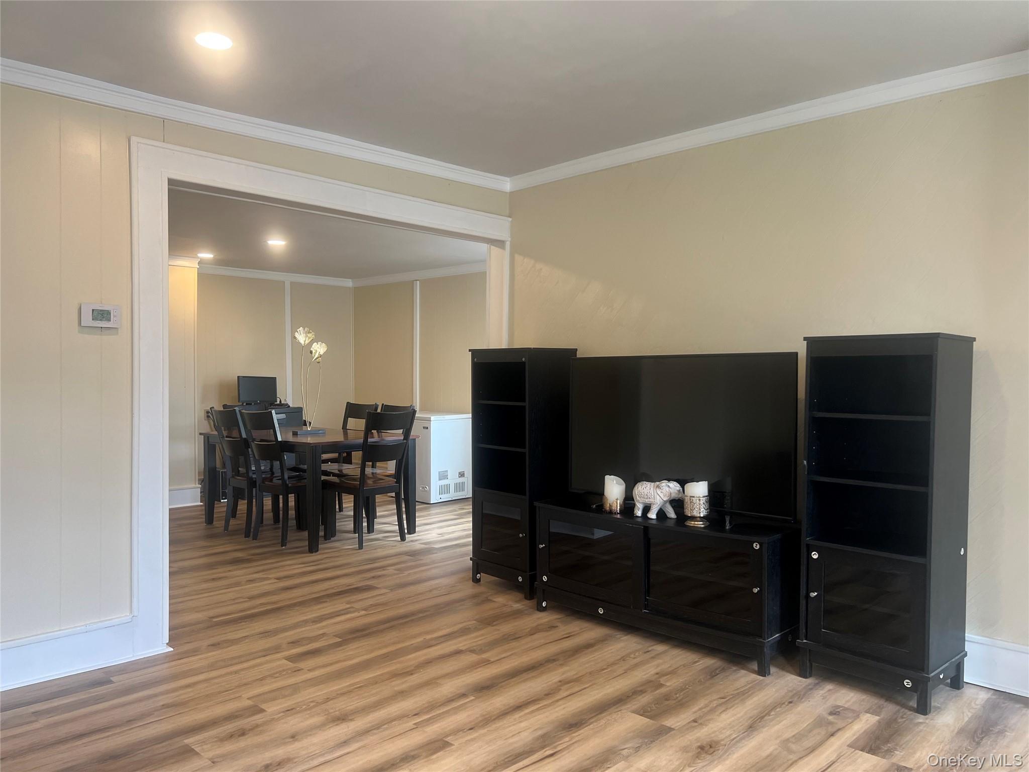 34 Smith Street Poughkeepsie, NY 12601 - Photo 6 of 46 a view of a livingroom with furniture and wooden floor