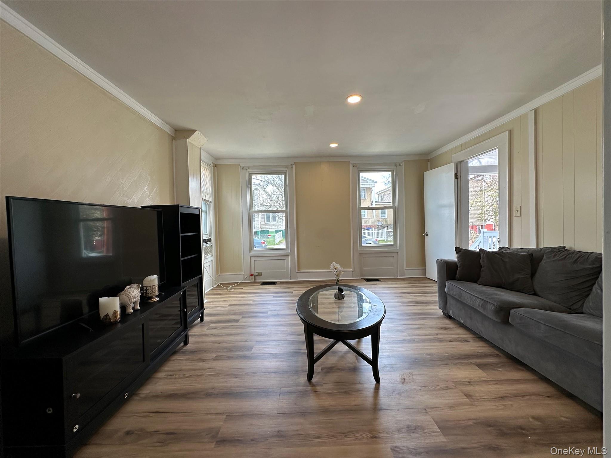 34 Smith Street Poughkeepsie, NY 12601 - Photo 8 of 46 a living room with furniture and a flat screen tv