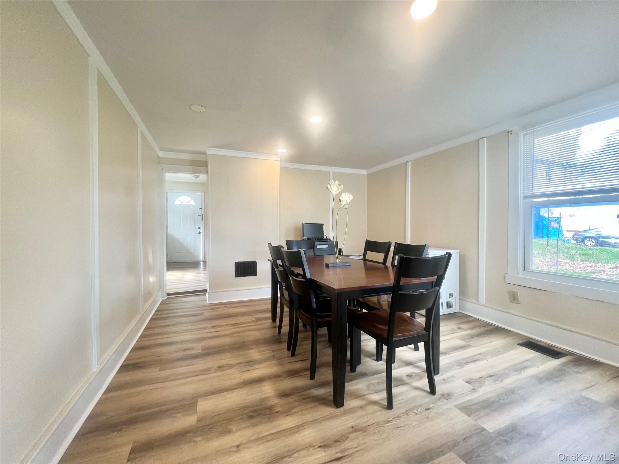 34 Smith Street Poughkeepsie, NY 12601 - Photo 9 of 46 a view of a a dining room with furniture window and wooden floor