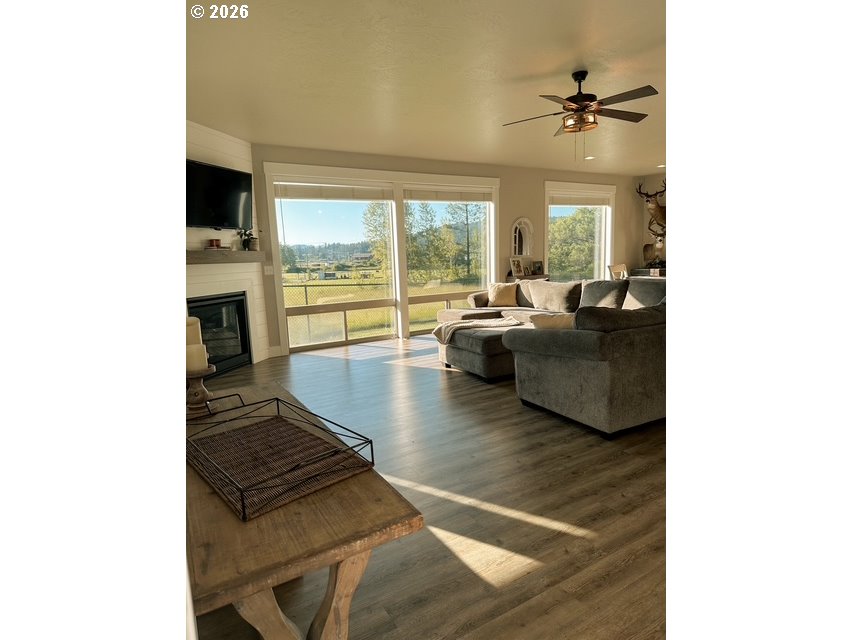 946 South Calapooia Street Sutherlin, OR 97479 - Photo 3 of 31 a living room with furniture and a fireplace