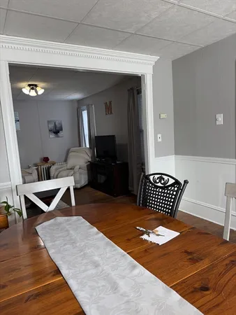 a bedroom with furniture and a wooden floor