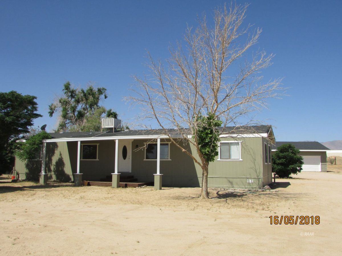1149 North Calvert Boulevard Ridgecrest, CA 93555 - Photo 1 of 1 a front view of a house with a yard