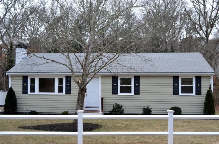 a front view of a house with garage