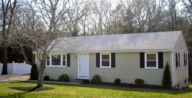 147 Straightway Hyannis, MA 02601 - Photo 30 of 31 a front view of house with yard and trees in the background