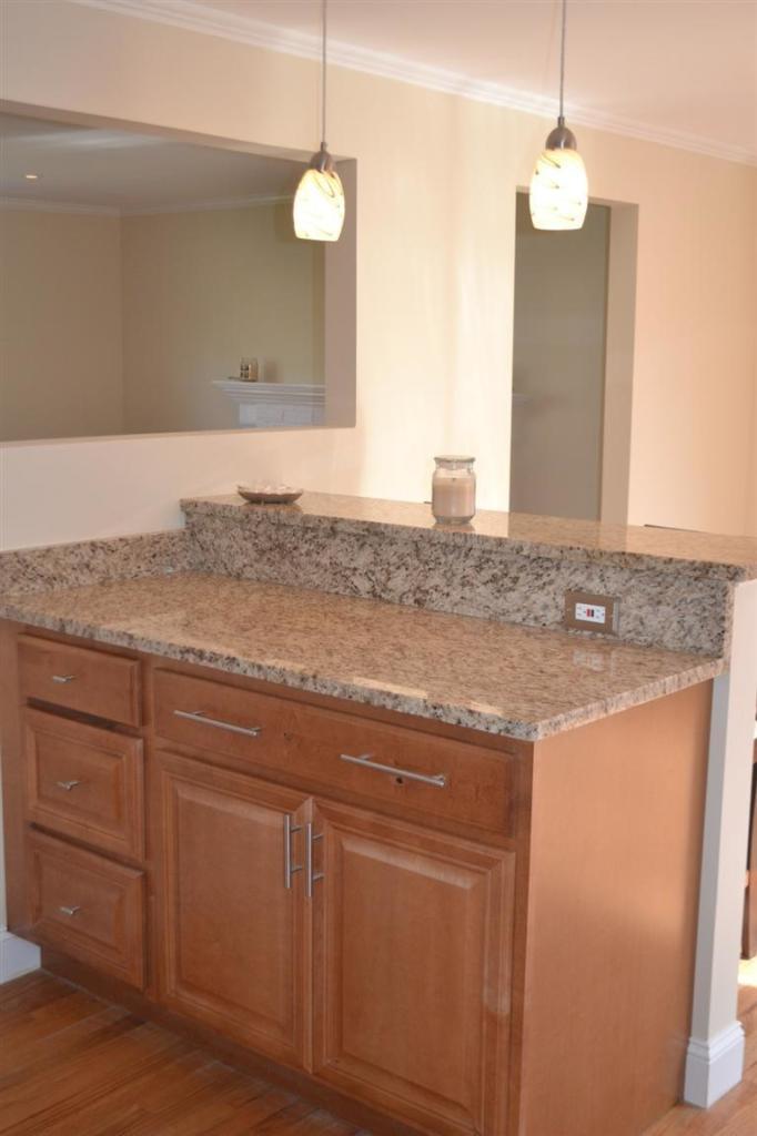 147 Straightway Hyannis, MA 02601 - Photo 9 of 31 a bathroom with a granite countertop sink and a mirror