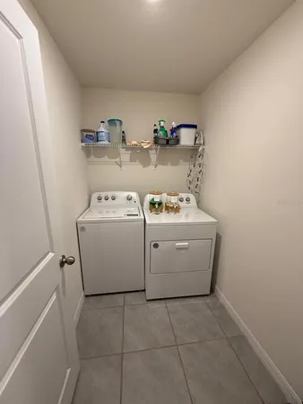a utility room with dryer and washer