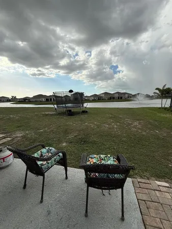 a view of a lake with outdoor seating