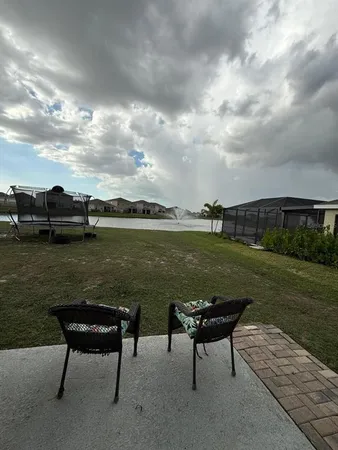 a view of a lake with outdoor seating