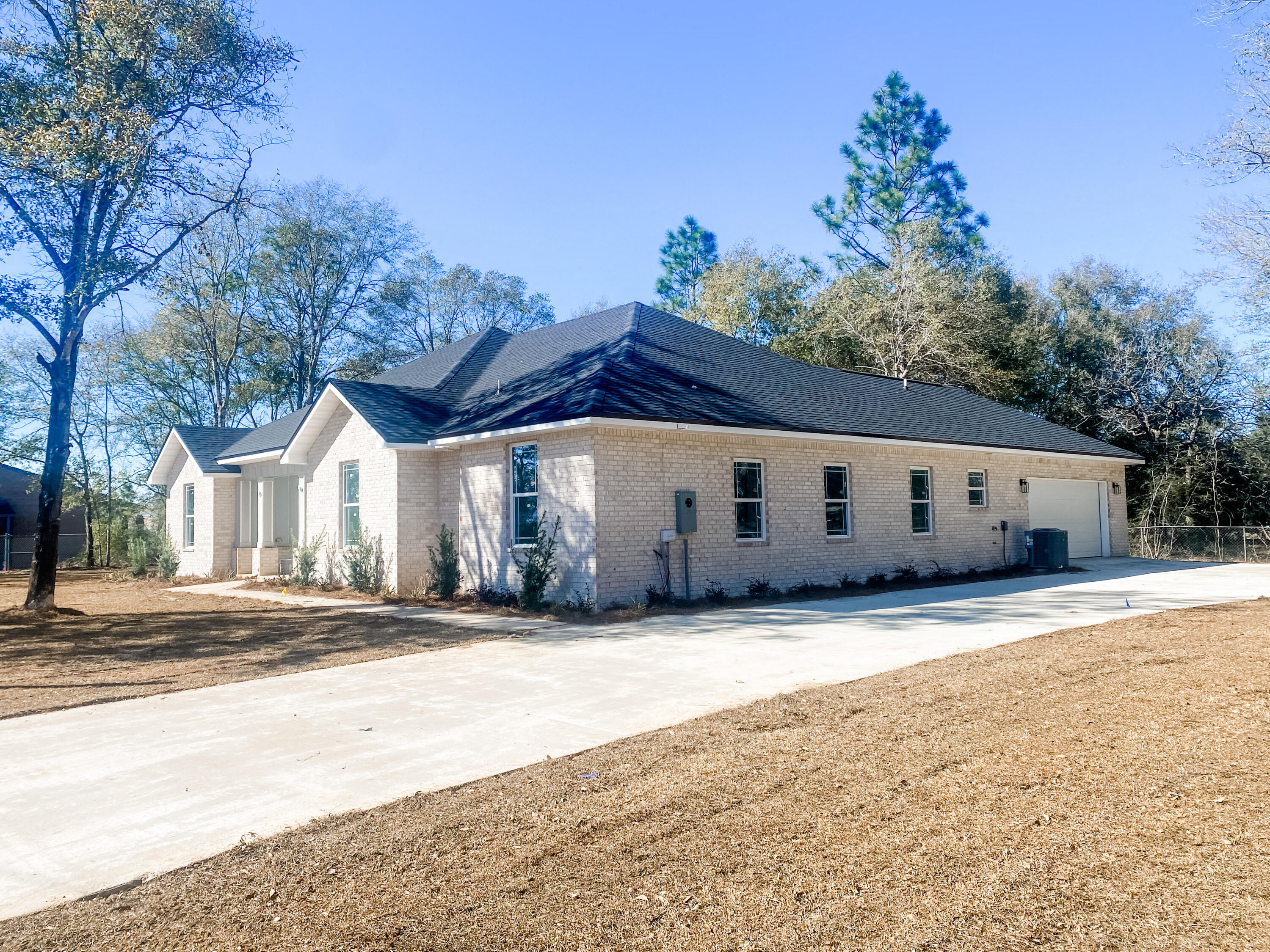 5464 Jenee Court Crestview, FL 32539 - Photo 3 of 10 a front view of a house with a yard and garage