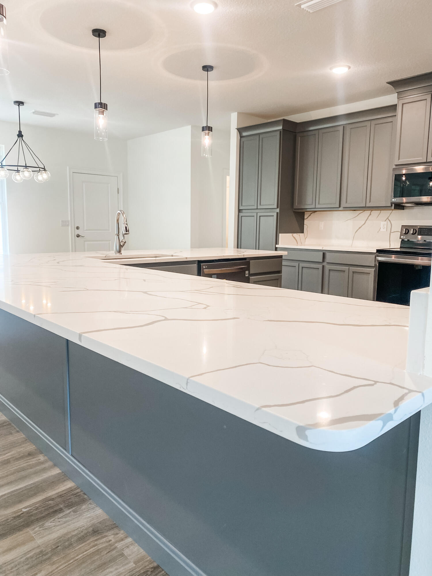 5464 Jenee Court Crestview, FL 32539 - Photo 5 of 10 a kitchen with kitchen island a sink stainless steel appliances and cabinets