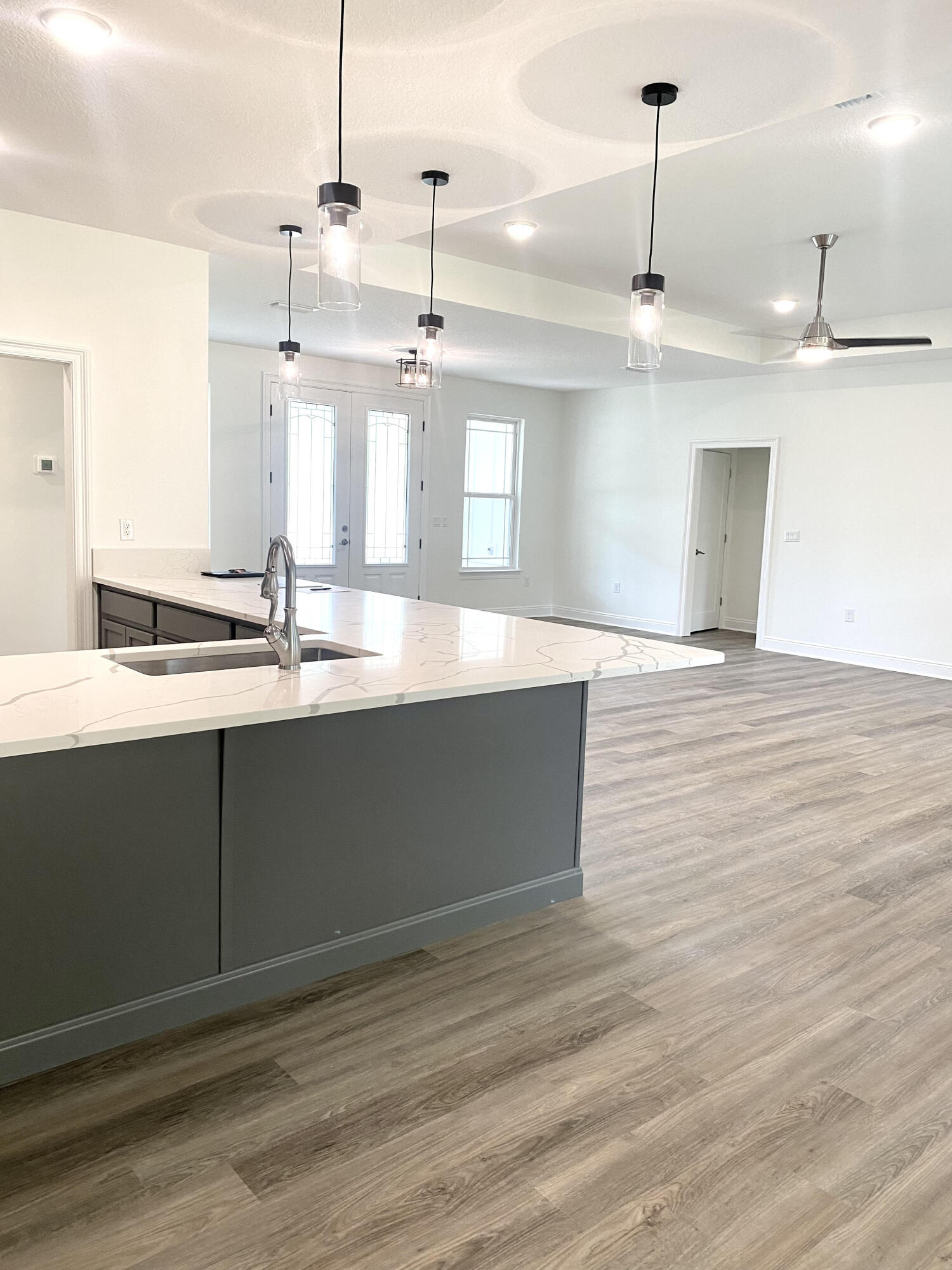 5464 Jenee Court Crestview, FL 32539 - Photo 6 of 10 a large kitchen with stainless steel appliances kitchen island a large island in the center