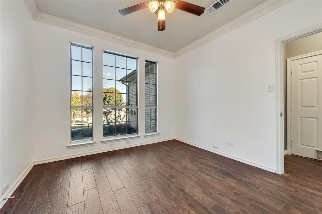2836 Morning Star Drive Fort Worth, TX 76131 - Photo 14 of 27 a view of an empty room with wooden floor and a window