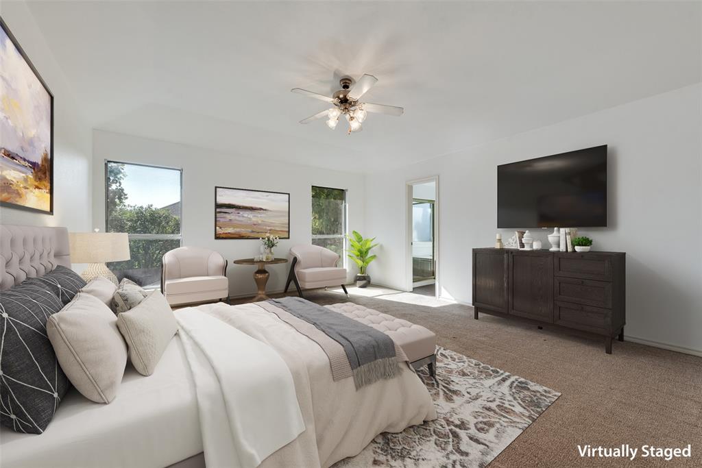 2836 Morning Star Drive Fort Worth, TX 76131 - Photo 16 of 27 a bedroom with a bed and a flat screen tv