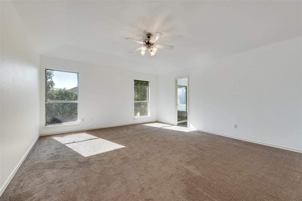 2836 Morning Star Drive Fort Worth, TX 76131 - Photo 17 of 27 an empty room with windows and fan