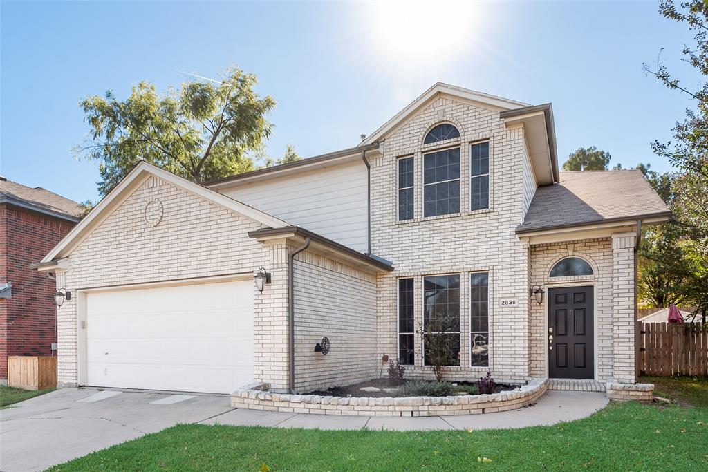 2836 Morning Star Drive Fort Worth, TX 76131 - Photo 2 of 27 a front view of a house with a yard and garage