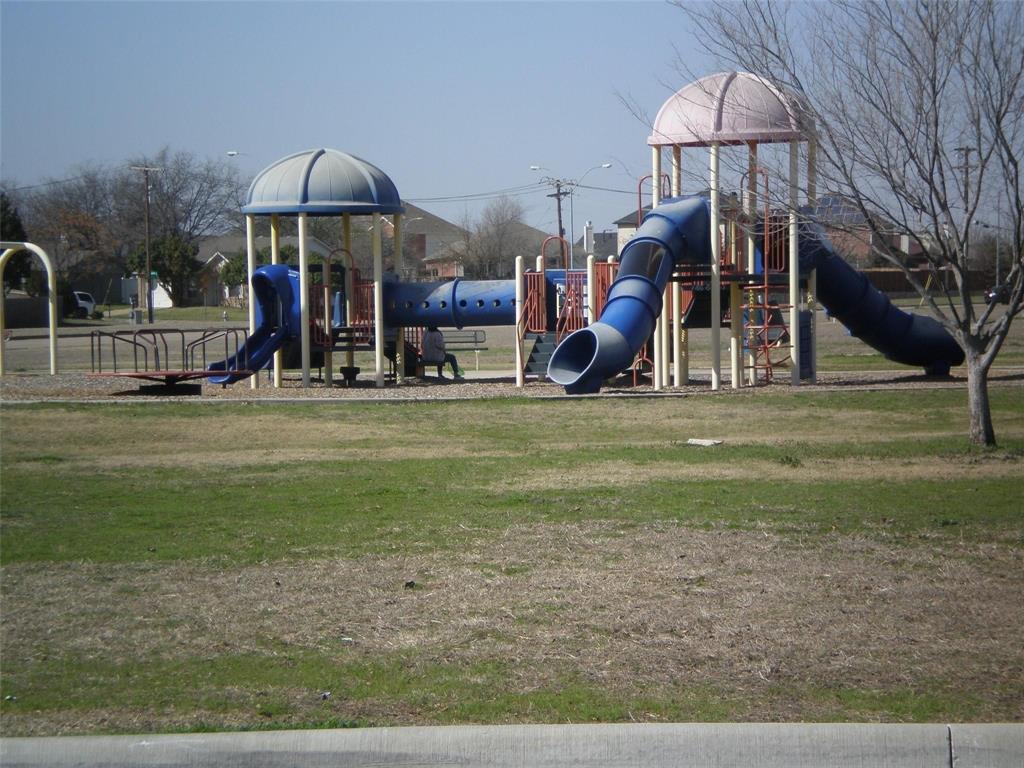 2836 Morning Star Drive Fort Worth, TX 76131 - Photo 25 of 27 a view of a park with swings and slides