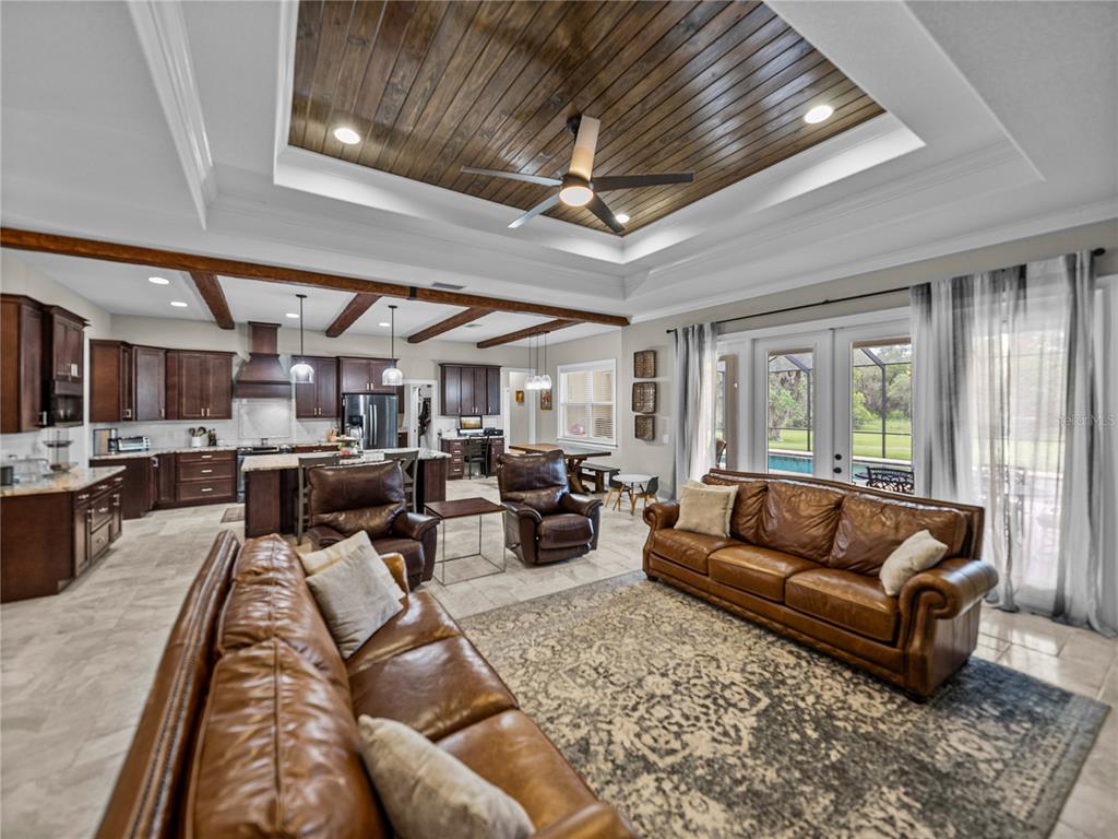3985 Mammoth Grove Road Lake Wales, FL 33898 - Photo 11 of 97 a living room with furniture kitchen view and a large window