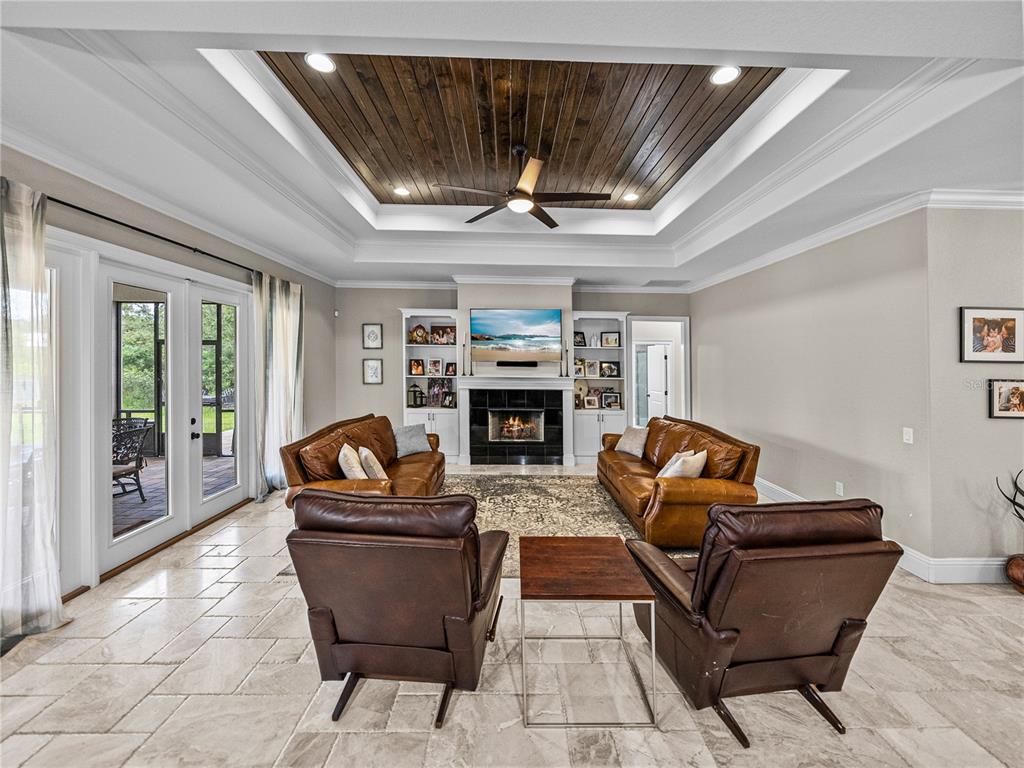 3985 Mammoth Grove Road Lake Wales, FL 33898 - Photo 12 of 97 a living room with furniture and a fireplace
