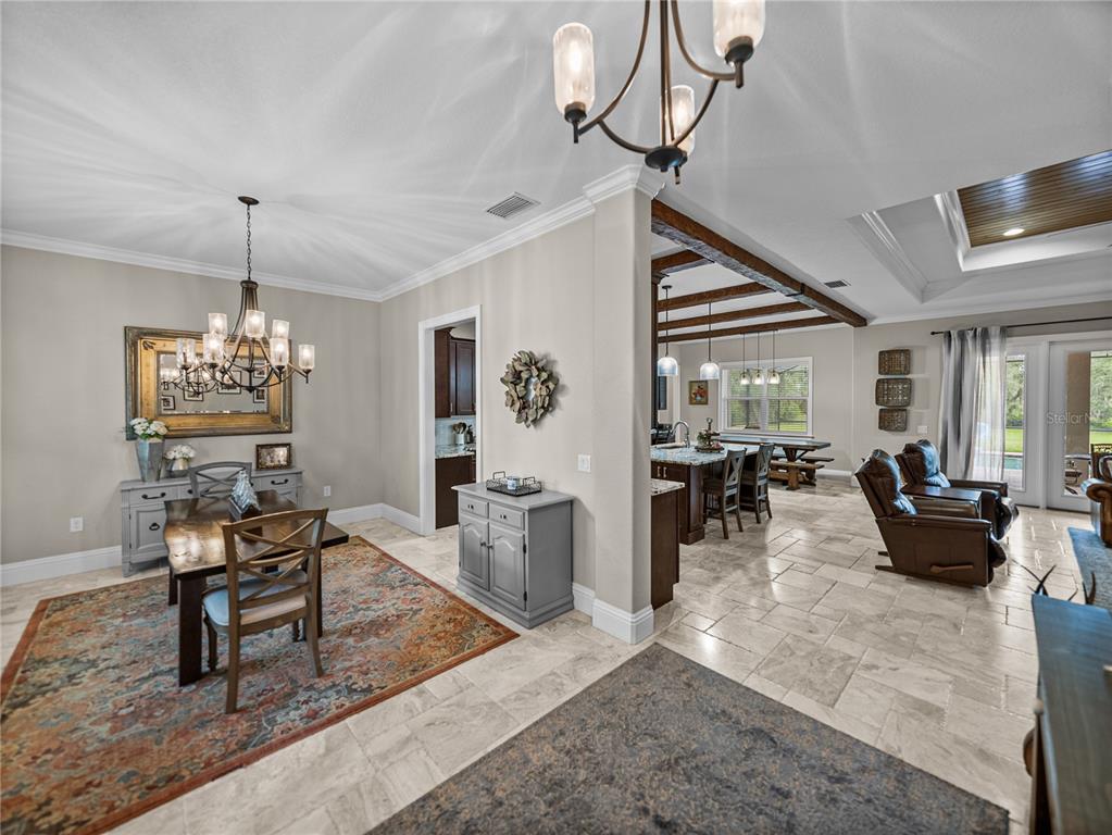 3985 Mammoth Grove Road Lake Wales, FL 33898 - Photo 13 of 97 a living room with furniture and a chandelier