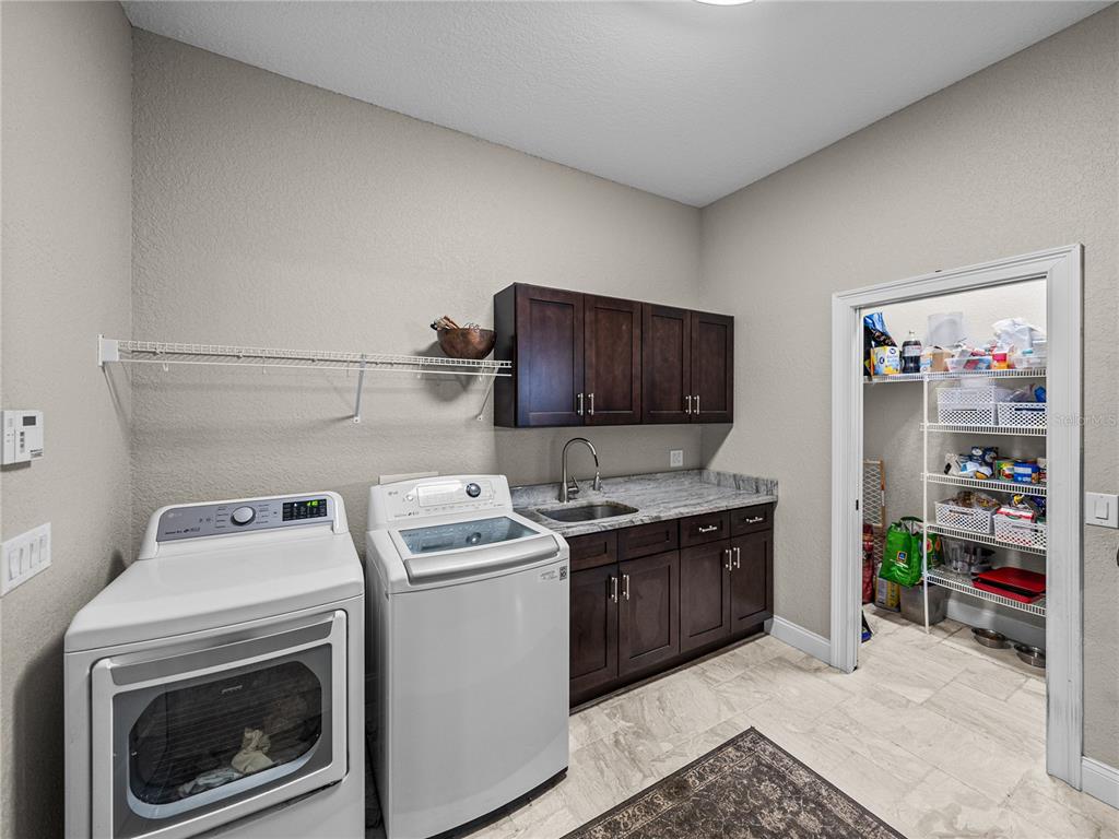 3985 Mammoth Grove Road Lake Wales, FL 33898 - Photo 31 of 97 a view of storage and utility room with washer and dryer