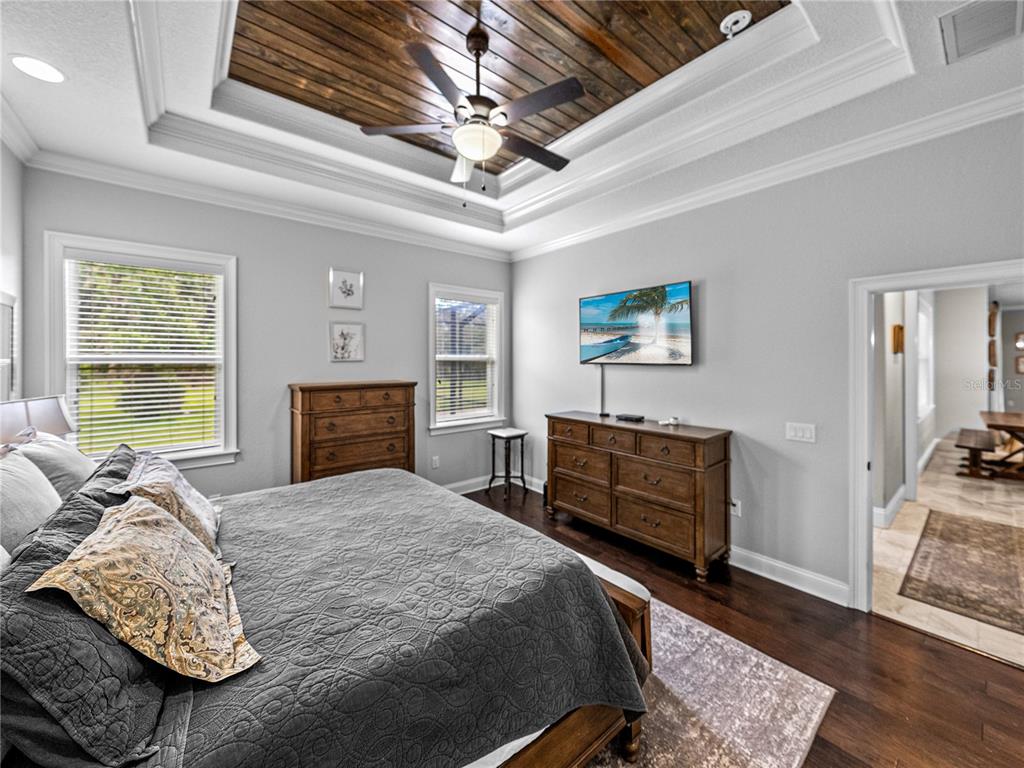 3985 Mammoth Grove Road Lake Wales, FL 33898 - Photo 39 of 97 a bedroom with a bed and wooden floor