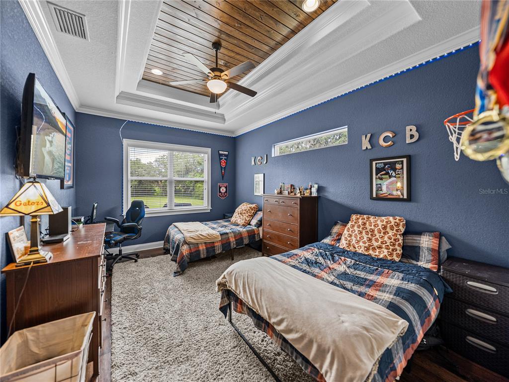 3985 Mammoth Grove Road Lake Wales, FL 33898 - Photo 49 of 97 a bedroom with two beds and a large window