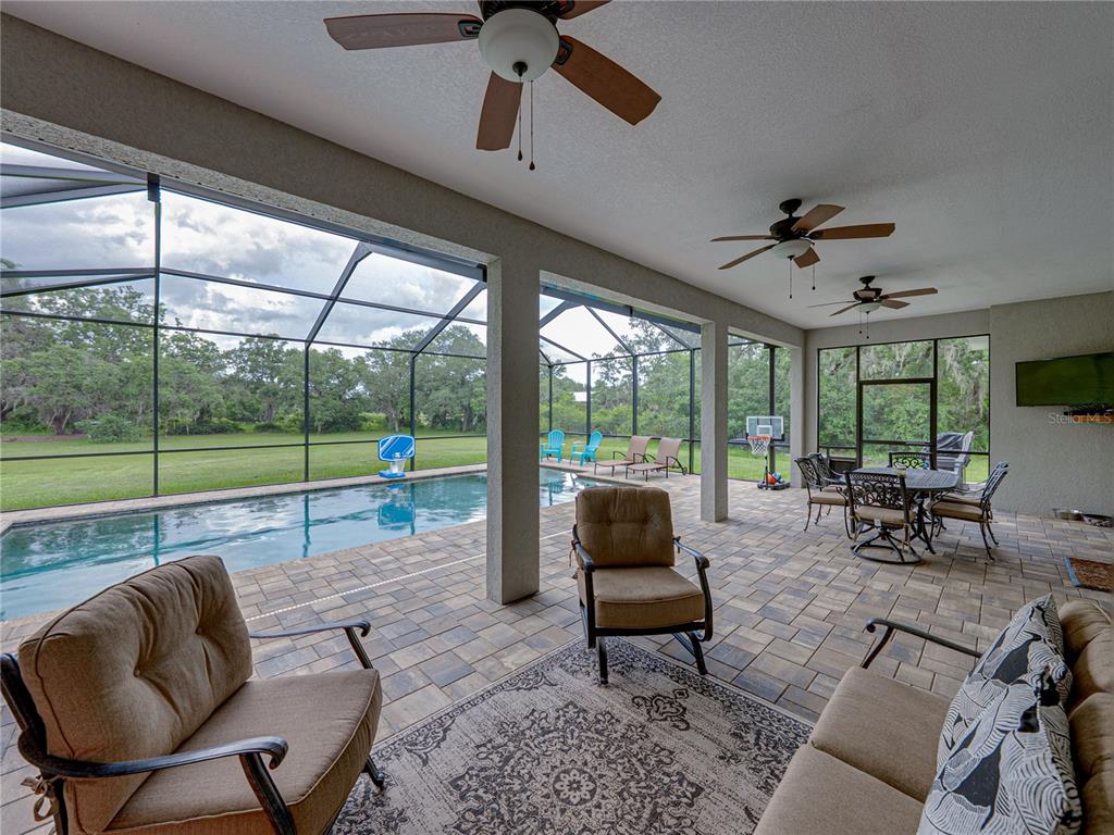 3985 Mammoth Grove Road Lake Wales, FL 33898 - Photo 67 of 97 a living room with furniture and a floor to ceiling window