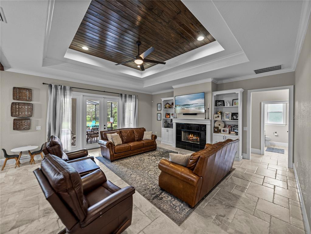 3985 Mammoth Grove Road Lake Wales, FL 33898 - Photo 7 of 97 a living room with furniture and a fireplace
