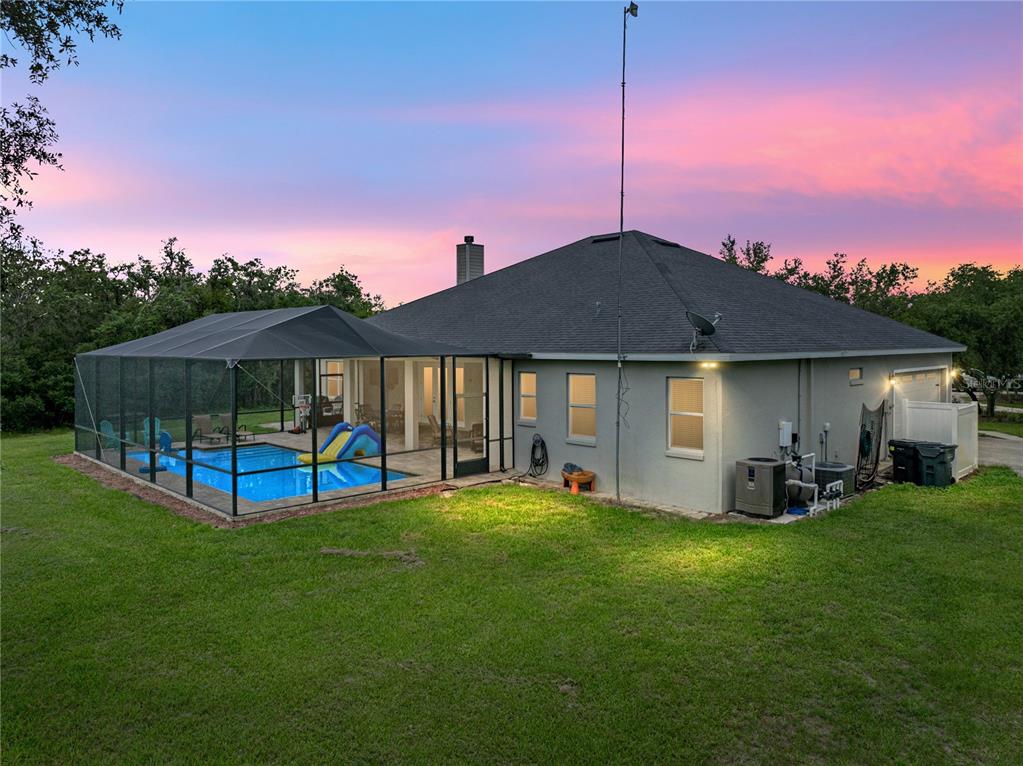 3985 Mammoth Grove Road Lake Wales, FL 33898 - Photo 77 of 97 a view of a house with a yard and sitting area
