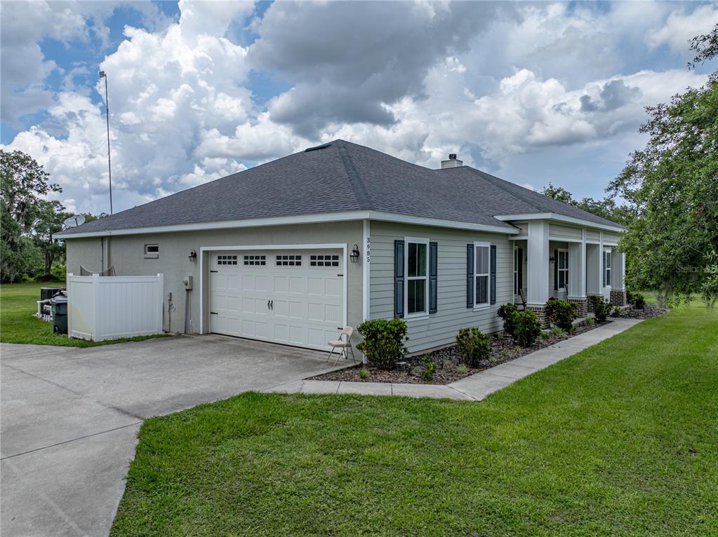 3985 Mammoth Grove Road Lake Wales, FL 33898 - Photo 78 of 97 a view of a house with garden and yard